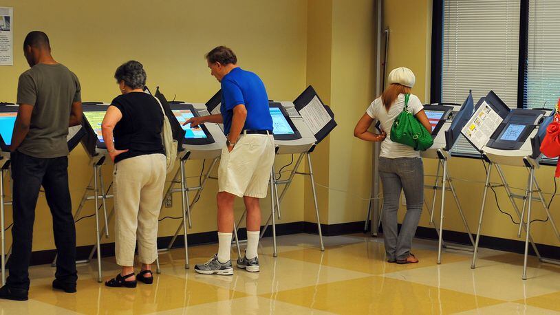 Voters take advantage of early voting on a Saturday. BRANT SANDERLIN / BSANDERLIN@AJC.COM