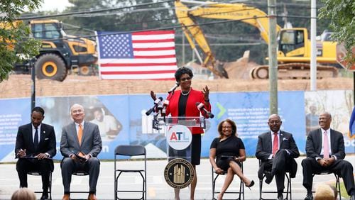 With the presence of HUD Deputy Secretary Adrienne Todman, Vicky Lundy Wilbon, principal and president of real estate Integral Group, speaks during the groundbreaking of Ashley Scholars Landing II, which will have 212 units of mixed-income housing and more than 240 parking spaces.
 Miguel Martinez /miguel.martinezjimenez@ajc.com