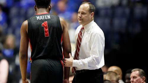 Georgia forward Yante Maten (1) walks to the bench past head coach Mark Fox late in the second half of an NCAA college basketball game between Georgia and Kentucky at the Southeastern Conference tournament Friday, March 10, 2017, in Nashville, Tenn. Kentucky won 71-60. (AP Photo/Wade Payne)