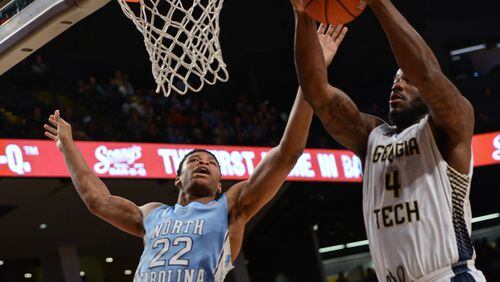 Georgia Tech center Demarco Cox (4) grabs an offensive rebound from North Carolina forward Isaiah Hicks (22) during the first half of an NCAA college basketball game Tuesday, March 3, 2015, in Atlanta. (AP Photo/Jon Barash) Georgia Tech center Demarco Cox scored in double digits for the 15th time this season and fourth time in the past six games with 14 against North Carolina Tuesday night. (ASSOCIATED PRESS)