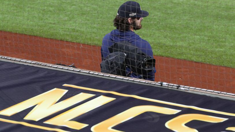 Ian Anderson takes in the scene for the NLCS from the team dugout during their workout for the best-of-seven National League Championship Series against the Dodgers at Globe Life Field on Sunday, Oct 11, 2020 in Arlington.