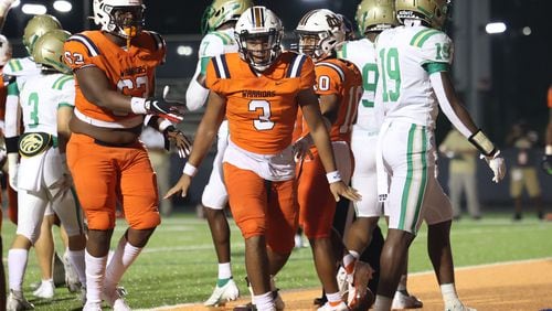 August 20, 2021 - Kennesaw, Ga: North Cobb quarterback Malachi Singleton (3) celebrates his rushing touchdown during the first half against Buford at North Cobb high school Friday, August 20, 2021 in Kennesaw, Ga.. JASON GETZ FOR THE ATLANTA JOURNAL-CONSTITUTION



