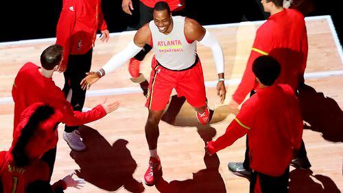 January 15, 2017, Atlanta: Dwight Howard gets fives from teammates taking the floor to play the Bucks in a NBA basketball game on Sunday, Jan. 15, 2017, in Atlanta. Curtis Compton/ccompton@ajc.com