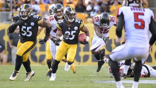 Pittsburgh Steelers Trey Williams (35) follows the block of Arthur Moats (55) after getting past Atlanta Falcons defenders Akeem King (25) and Duke Riley (42) to return the punt by punter Matt Bosher (5) for a touchdown in the third quarter of an NFL preseason football game, Sunday, Aug. 20, 2017, in Pittsburgh. (AP Photo/Fred Vuich)