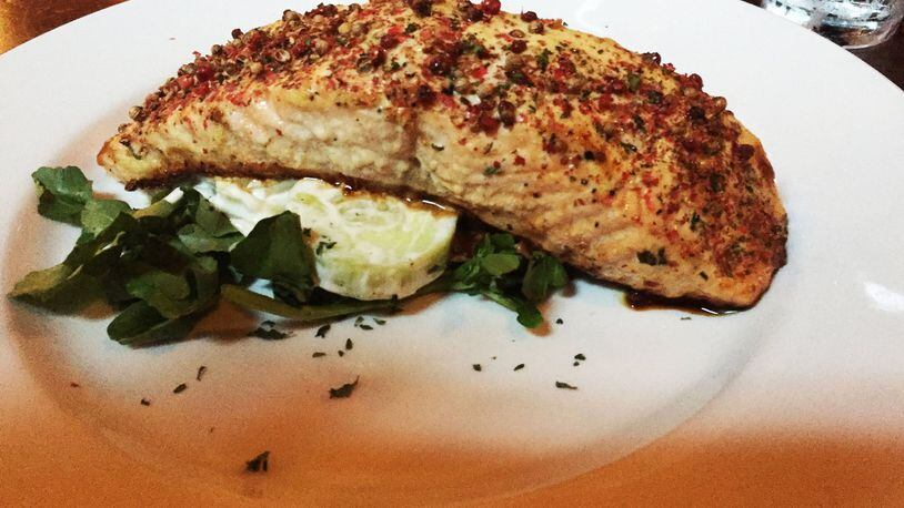 Truman’s peppered salmon is straightforward but high-quality. The menu now features a new salmon treatment featuring hoisin glaze and wilted spinach with Asian flavors. Photo by Elizabeth Lenhard