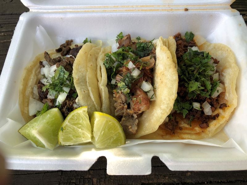 This order of tacos from La Mixteca Tamale House includes asada, carnitas and chorizo. CONTRIBUTED BY WENDELL BROCK