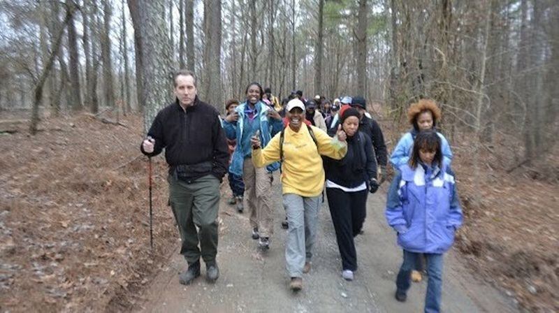 Carolyn Hartfield, 68, wants to get others in her age group interested in outdoor activities like hiking. Here, she leads a hike at Sweetwater Creek State Park. CONTRIBUTED