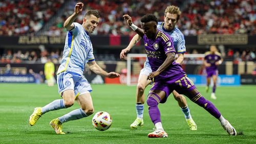 Atlanta United defender Brooks Lennon #11 challenges for the ball during the first half of the match against Orlando City at Mercedes-Benz Stadium in Atlanta, GA on Sunday March 17, 2024. (Photo by Alex Slitz/Atlanta United)