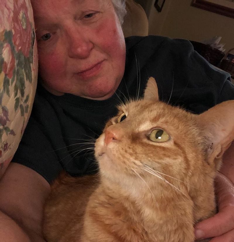 Decatur resident Joan Durdin, a 69-year-old, semi-retired nurse, pictured with her cat, Rufus, spent two days in a COVID-19 isolation ward when she started showing symptoms of the virus. She is back home in quarantine awaiting the results of her tests. SPECIAL