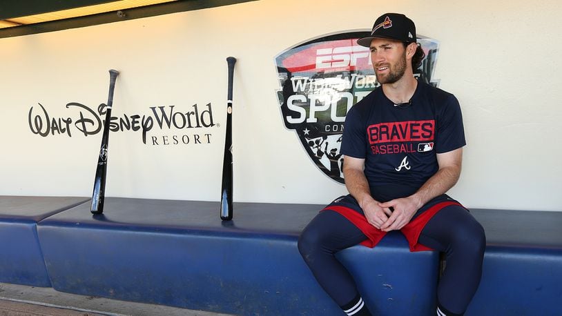 Braves infielder Charlie Culberson sits in the dugout with his bats before starting team practice  Wednesday, Feb 21, 2018, at the ESPN Wide World of Sports Complex in Lake Buena Vista.