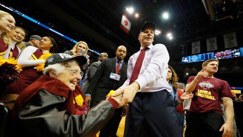 ATLANTA, GA - MARCH 24:  Sister Jean Dolores Schmidt celebrates with head coach Porter Moser of the Loyola Ramblers after defeating the Kansas State Wildcats during the 2018 NCAA Men's Basketball Tournament South Regional at Philips Arena on March 24, 2018 in Atlanta, Georgia. Loyola defeated Kansas State 78-62. (Photo by Kevin C. Cox/Getty Images)