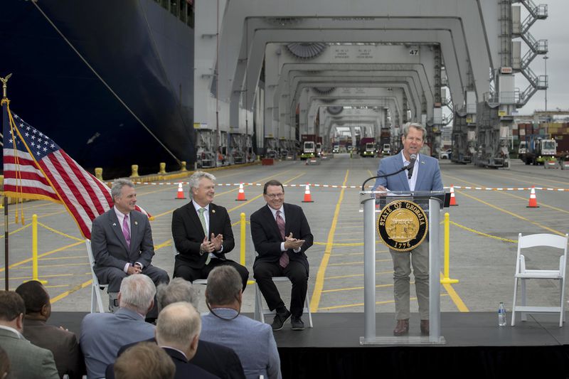 Georgia Gov. Brian Kemp, right, speaks during a visit to the Port of Savannah on Monday. From left to right: Republican U.S. Reps. Buddy Carter of St. Simons Island, Mike Collins of Jackson and Sam Graves of Missouri.