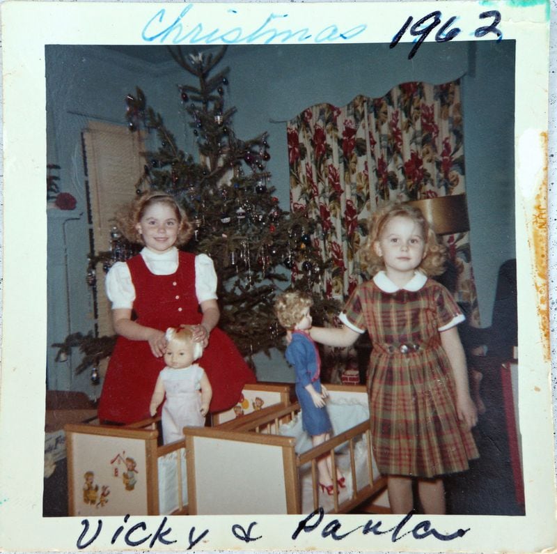 This family-provided photo shows sisters Vicki (left) and Paula, Christmas 1962. FAMILY PHOTO