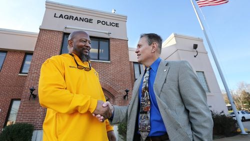 LaGrange Police Chief Louis M. Dekmar, right, and Troup County NAACP president Ernest Ward shake hands as they meet on Wednesday, Jan. 25, 2017, at the police department in LaGrange. The LaGrange police chief on Thursday will publicly apologize and acknowledge his agency’s role in the 1940 lynching of a black man taken from the local jail. CURTIS COMPTON/CCOMPTON@AJC.COM