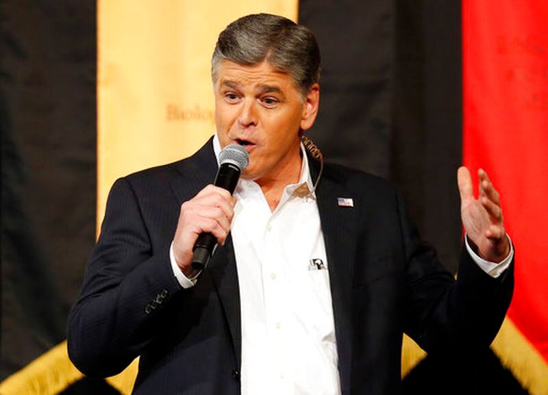 FILE - In this March 18, 2016, file photo, Fox News Channel's Sean Hannity speaks during a campaign rally for Republican presidential candidate, Sen. Ted Cruz, R-Texas, in Phoenix. Hannity told the New York Daily News for a story published April 23, 2017, that  accusations of sexual harassment from former Fox News contributor Debbie Schlussel are â100% false and a complete fabrication.â(AP Photo/Rick Scuteri, File)