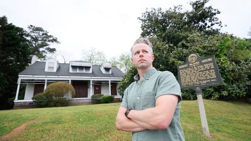 Trevor Beemon, head of Cobb Landmarks and Historical Society, stands outside the historic Eliza and Robert McAfee house in Marietta, which is currently embroiled in a dispute to determine its future.
Miguel Martinez /miguel.martinezjimenez@ajc.com