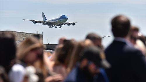 April 24, 2019 Atlanta - Air Force One approaches as people wait to see President Donald Trump and first lady Melania Trump arrive at Hartsfield-Jackson Airport on Wednesday, April 24, 2019. President Donald Trump and first lady Melania Trump addressed the Rx Drug Abuse and Heroin Summit at the Hyatt Regency Hotel in downtown Atlanta on Wednesday afternoon. HYOSUB SHIN / HSHIN@AJC.COM