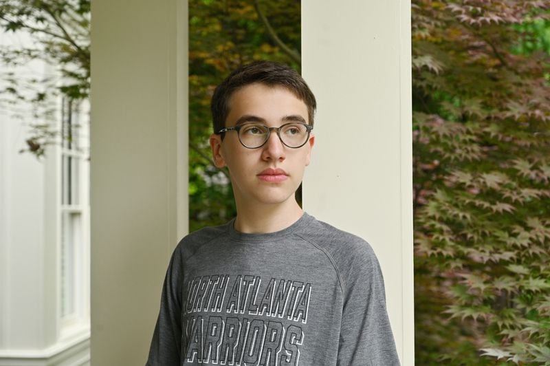 Matan Berg, 16, who a sophomore at North Atlanta High School, is shown at his home on Tuesday, May 11, 2021. Over the weekend, he started an online petition calling for APS to reverse its decision to start the high school day 45 minutes earlier next year. (Hyosub Shin / Hyosub.Shin@ajc.com)