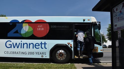 Customers get on a Gwinnett County Transit at Buford Highway and N. Berkeley Lake Road on Wednesday, May 2, 2018. HYOSUB SHIN / HSHIN@AJC.COM