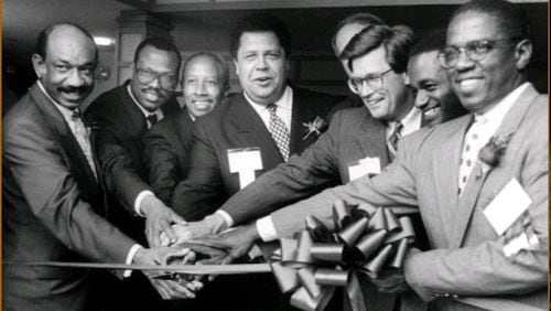 Mayor Maynard Jackson, center, attends a ribbon cutting with Herman Russell, left, Egbert Perry, second from left, and other Atlanta business leaders in approximately 1990. “Maynard created an environment in Atlanta that made it acceptable and even desirable for Black businesses to get opportunities to participate in the economics of the city,” Perry says. (Courtesy of Egbert Perry)