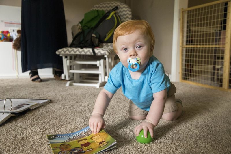 Easton Walker plays with his toys at his home in Lawrenceville. ALYSSA POINTER/ATLANTA JOURNAL-CONSTITUTION