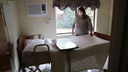 033021 Jackson: Administrator Jennifer Vasil, RN, looks over a bed in an empty room on the hallway where residents with Covid used to be and have since died at Westbury Medical Care and Rehab on Tuesday, March 30, 2021, in Jackson.  “Curtis Compton / Curtis.Compton@ajc.com”