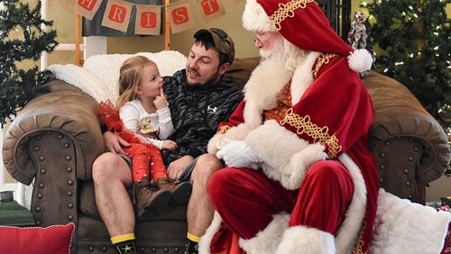 Derek Dugan of Buford, known as “Santa Derek," helped other Santas this year with setting up home studios for virtual visits with children. Dugan's schedule this year includes a mix of in-person and online Santa appearances.