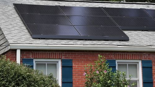 Cities and individuals around Georgia, such as the owners of this Decatur home with solar panels, are working toward clean energy. (Curtis Compton / ccompton@ajc.com)