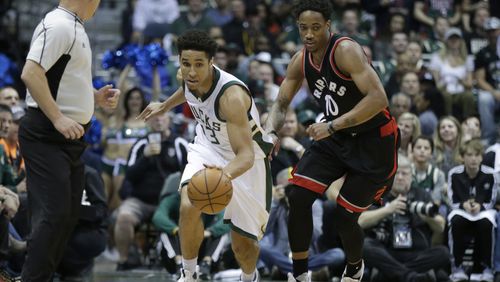 Malcolm Brogdon (13) of the Milwaukee Bucks dribbles the basketball up the court with DeMar DeRozan of the Toronto Raptors defending during the first half of Game Four of the Eastern Conference Quarterfinals during the 2017 NBA Playoffs at the BMO Harris Bradley Center on April 22, 2017 in Milwaukee, Wisconsin. (Photo by Mike McGinnis/Getty Images)