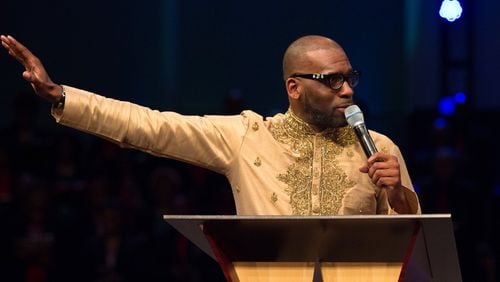 Jamal Bryant delivers his first sermon as the official pastor of New Birth Missionary Baptist Church in Stonecrest. STEVE SCHAEFER / SPECIAL TO THE AJC