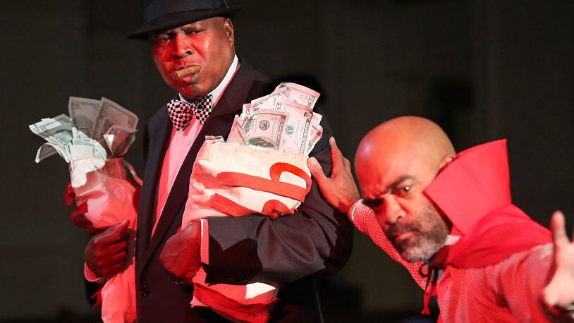The greedy rich man, played by Floyd Baxter, is lead away to Hell by Satan, played by Glenn Samuels, during rehearsals for the 86th annual run of “Heaven Bound” at Big Bethel AME Church in Atlanta. Curtis Compton/ccompton@ajc.com