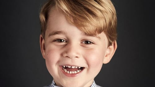 Prince George  smiles for his fourth birthday pictures.