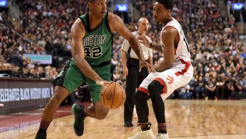Boston Celtics’ Al Horford (42) drives past Toronto Raptors’ DeMar DeRozan during the first half of an NBA basketball game Friday, Feb. 24, 2017, in Toronto. /The Canadian Press via AP)