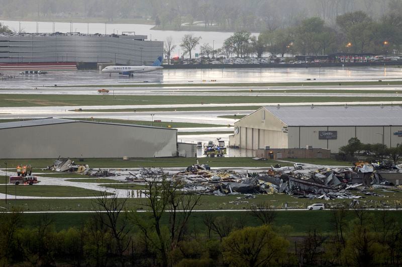 Severe weather damage to Eppley Airfield in Omaha, Neb., can be seen from the Lewis and Clark Monument in Council Bluffs, Iowa, Friday, April 26, 2024. (Anna Reed/Omaha World-Herald via AP)
