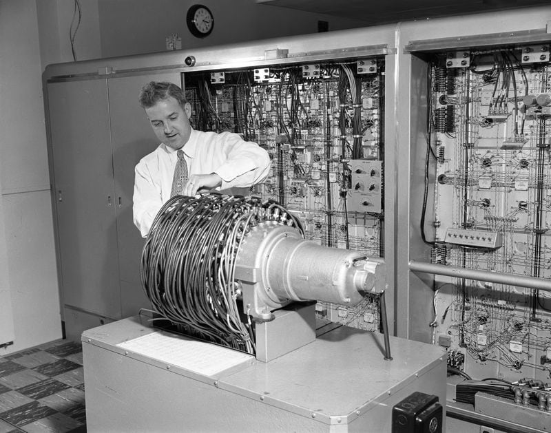 You know how you'll get an alert saying you're almost out of memory, so you have do delete some of the cat videos off your desktop? I'm pretty sure that is nothing like what Willaim A. Bezaire, chief electronics engineer, examines the magnetic storage drum memory of the ERA 1101 on Oct. 24, 1955.