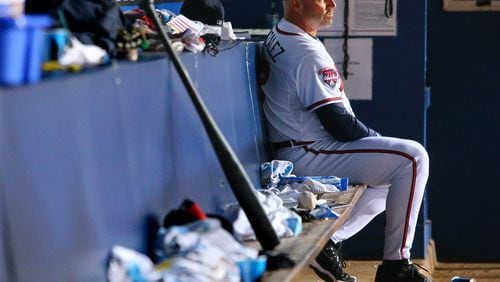 092514 Atlanta: Braves manager Fredi Gonzalez watches from the dugout as the Braves fall behind the Pirates 10-0 during the eight inning in a baseball game on Thursday, Sept. 25, 2014, in Atlanta. CURTIS COMPTON / CCOMPTON@AJC.COM Fredi Gonzalez watched the Braves spiral down the stretch again. (Curtis Compton, AJC)