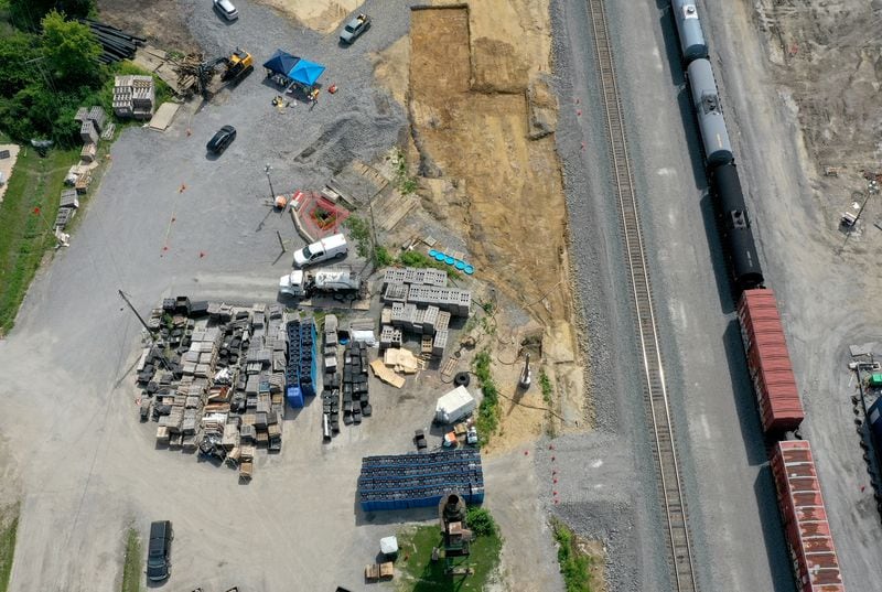 An aerial photo shows cleanup and remediation continuing on the site of the Feb. 3 Norfolk Southern freight train derailment, Saturday, July 15, 2023, in East Palestine. (Matt Freed for the Atlanta Journal Constitution)