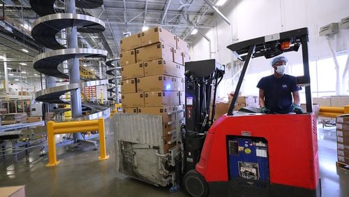 092021 Lithia Springs: A lift operator moves boxes of finished product for shipping from the end of a production line at Medline on Monday, Sept 20, 2021, in Lithia Springs.   “Curtis Compton / Curtis.Compton@ajc.com”