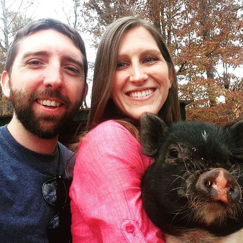 Playing with the many animals at Blackberry Farmstead is part of Thanksgiving. Here, Bill King’s son Bill and his wife, Jenny, visit with a potbellied pig named Buzz Lightyear. CONTRIBUTED BY OLIVIA KING