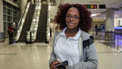 Vernetta Jackson works the overnight shift at the Hartsfield-Jackson International Airport for Enterprise Rent-A-Car so she can go to school during the day and spend time with her 6-month-old baby. STEVE SCHAEFER / SPECIAL TO THE AJC