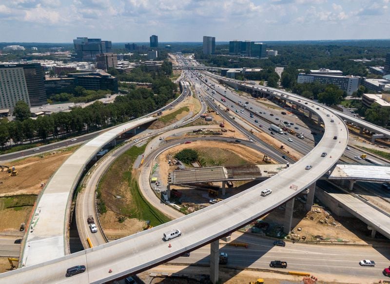 The rebuilding of the I-285/Ga. 400 interchange had been set for completion by the end of this year, but the contractors on the project recently told the Georgia Department of Transportation that the work could drag on until the third quarter of 2022. (Hyosub Shin / Hyosub.Shin@ajc.com)