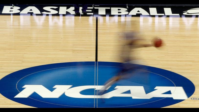 The NCAA long enforced rules against college athletes monetizing their fame before being forced to back down on name, image and likeness compensation last year. (AP Photo/Darron Cummings, File) </p> <p> FILE - In this March 14, 2012, file photo, a player runs across the NCAA logo during practice at the NCAA tournament college basketball in Pittsburgh. The NCAA Board of Governors took the first step Tuesday, Oct. 29, 2019, toward allowing athletes to cash in on their fame, voting unanimously to clear the way for the amateur athletes to "benefit from the use of their name, image and likeness." (AP Photo/Keith Srakocic, File) </p>