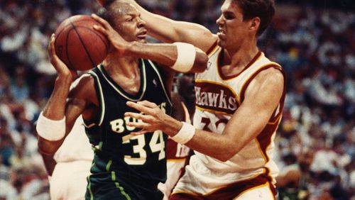 Jon Koncak of the Hawks defends against Terry Cummings during the playoffs in 1989. William Berry / AJC file photo