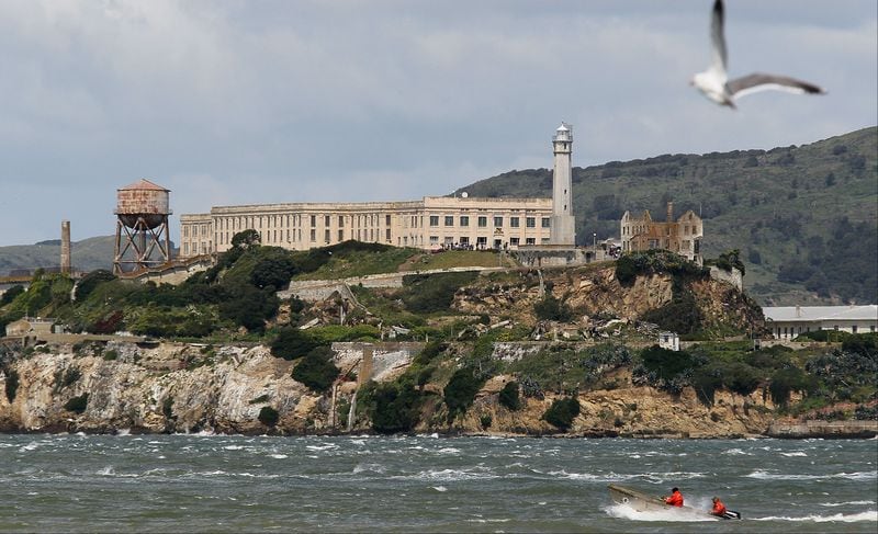 A boat passes in front of Alcatraz Island on April 7, 2011, in San Francisco Bay. The island houses the former Alcatraz Federal Penitentiary, from which three men escaped in 1962 and vanished.