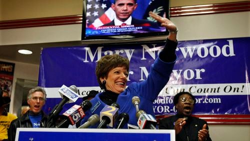 Mary Norwood waves to supporters as she makes an election night appearance at the Varsity in her runoff against Kasim Reed. Norwood lost the runoff to Reed.