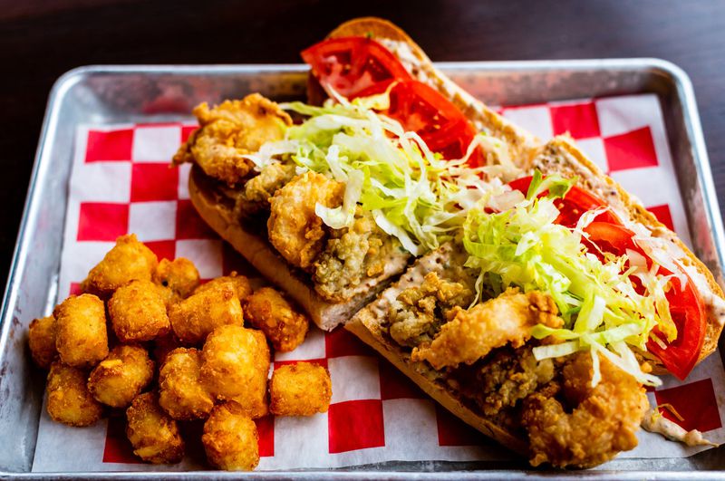 The “Shoyster” po’boy at Lagarde American Eatery gives you a mix of fried oysters and fried shrimp. CONTRIBUTED BY HENRI HOLLIS