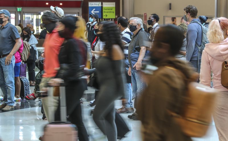 In this file photo, lines at Hartsfield-Jackson International Airport stretched through the domestic terminal atrium and down hallways. (John Spink / John.Spink@ajc.com)


