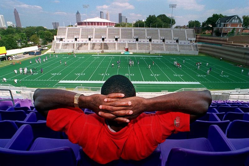 Former Morris Brown football player Henry Huntley enjoys the view from the 50-yard line at the school's new $21 million Herndon Stadium during practice in 1996. (Rich Addicks / AJC file)