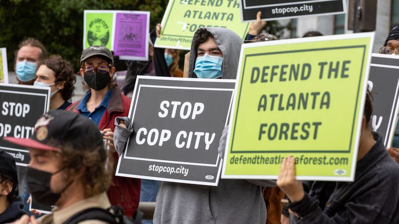 Demonstrators protest the construction of a new public safety training center during a press conference at City Hall in Atlanta on Tuesday, January 31, 2023. (Arvin Temkar / arvin.temkar@ajc.com)