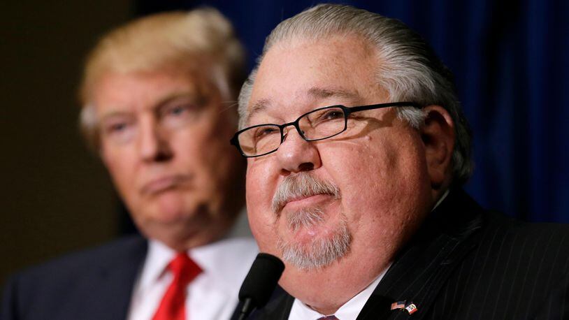 In this Aug. 25, 2016, file photo, Sam Clovis speaks during a news conference as then-Republican presidential candidate Donald Trump, left, watches before a campaign rally in Dubuque, Iowa. Clovis, a former Trump campaign official who has been linked to the investigation by special counsel Robert Mueller, has withdrawn his nomination for an Agriculture post. (AP Photo/Charlie Neibergall)